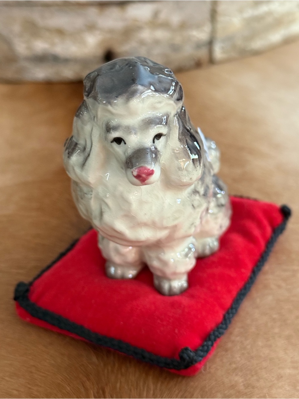 Vintage White and Gray Porcelain Poodle Figurine on Red Pillow
